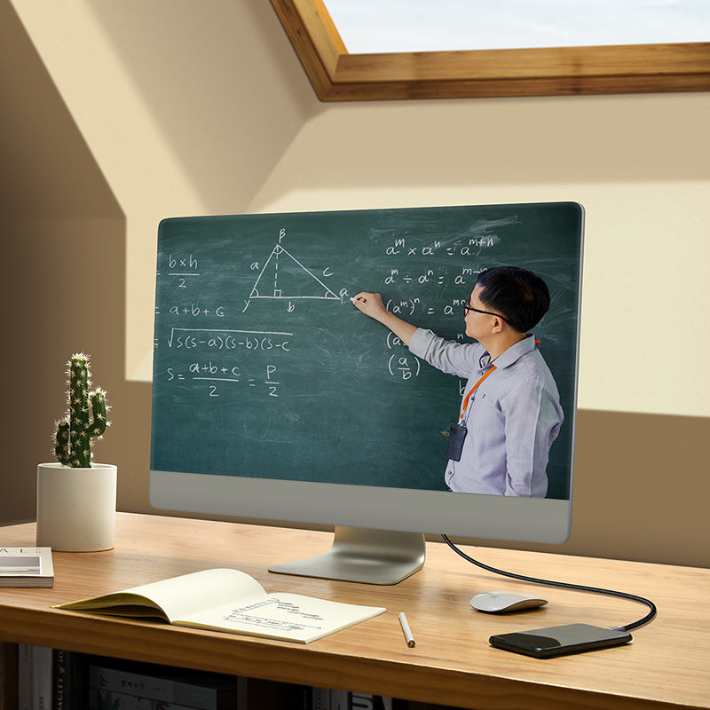 Person teaching math on a computer screen in a home office setting
