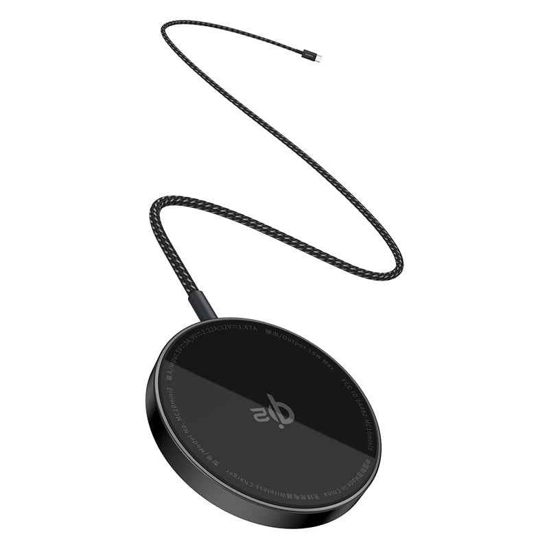 Black round device with a cord on a white background