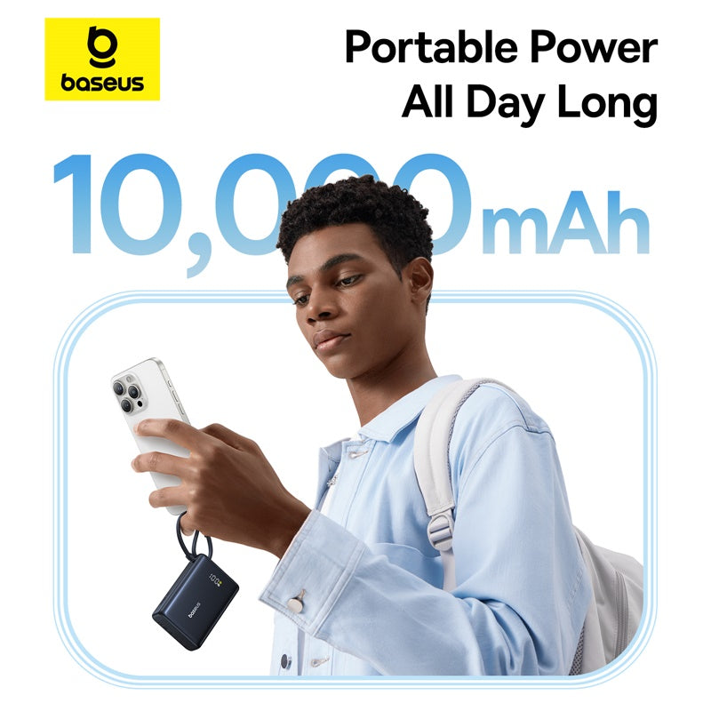 Person holding a phone with a portable power bank, Baseus branding visible
