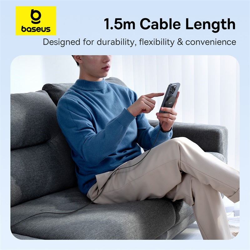 Person sitting on a couch using a phone with a 1.5m cable, Baseus brand visible