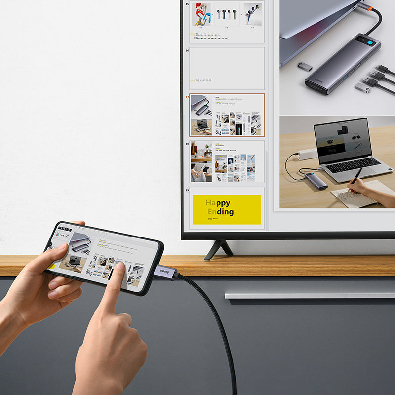 Person using a smartphone to control a smart TV displaying multiple screens.