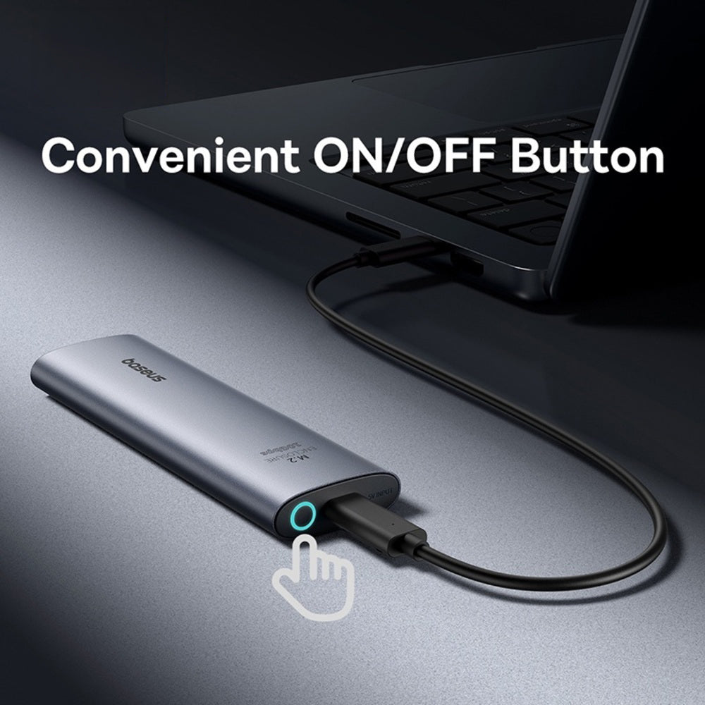 A silver portable power bank connected to a laptop with a black cable, shown on a dark gray surface. White text reads 'Convenient ON/OFF Button' with a hand icon pointing to a small circular button on the power bank.
