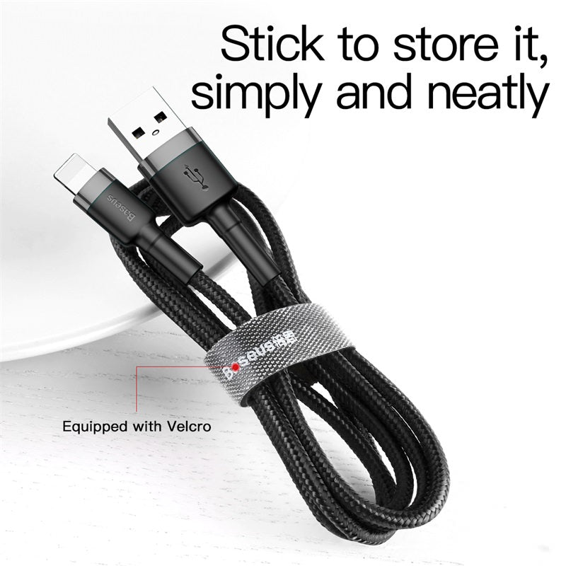 Coiled USB cable with a Velcro strap on a white background
