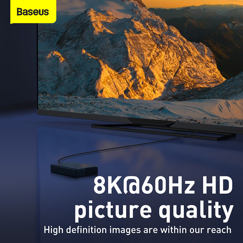 Television displaying a mountain scene with Baseus branding and text about 8K@60Hz HD picture quality.