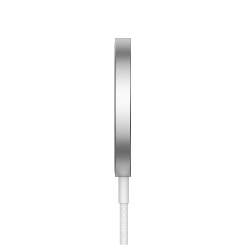 Silver circular device with a white cable on a white background