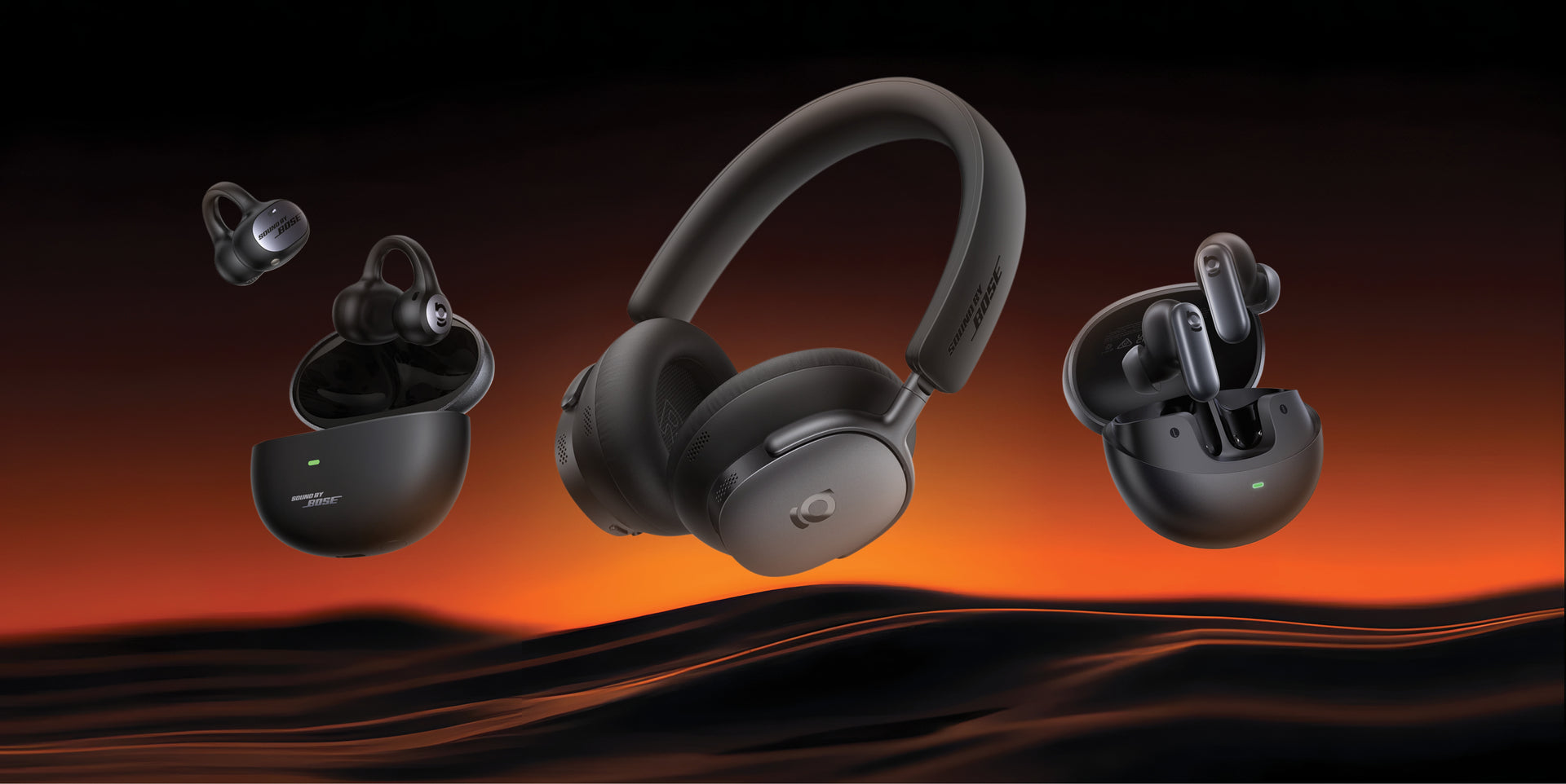 Black wireless earbuds and headphones on a dark background with orange gradient